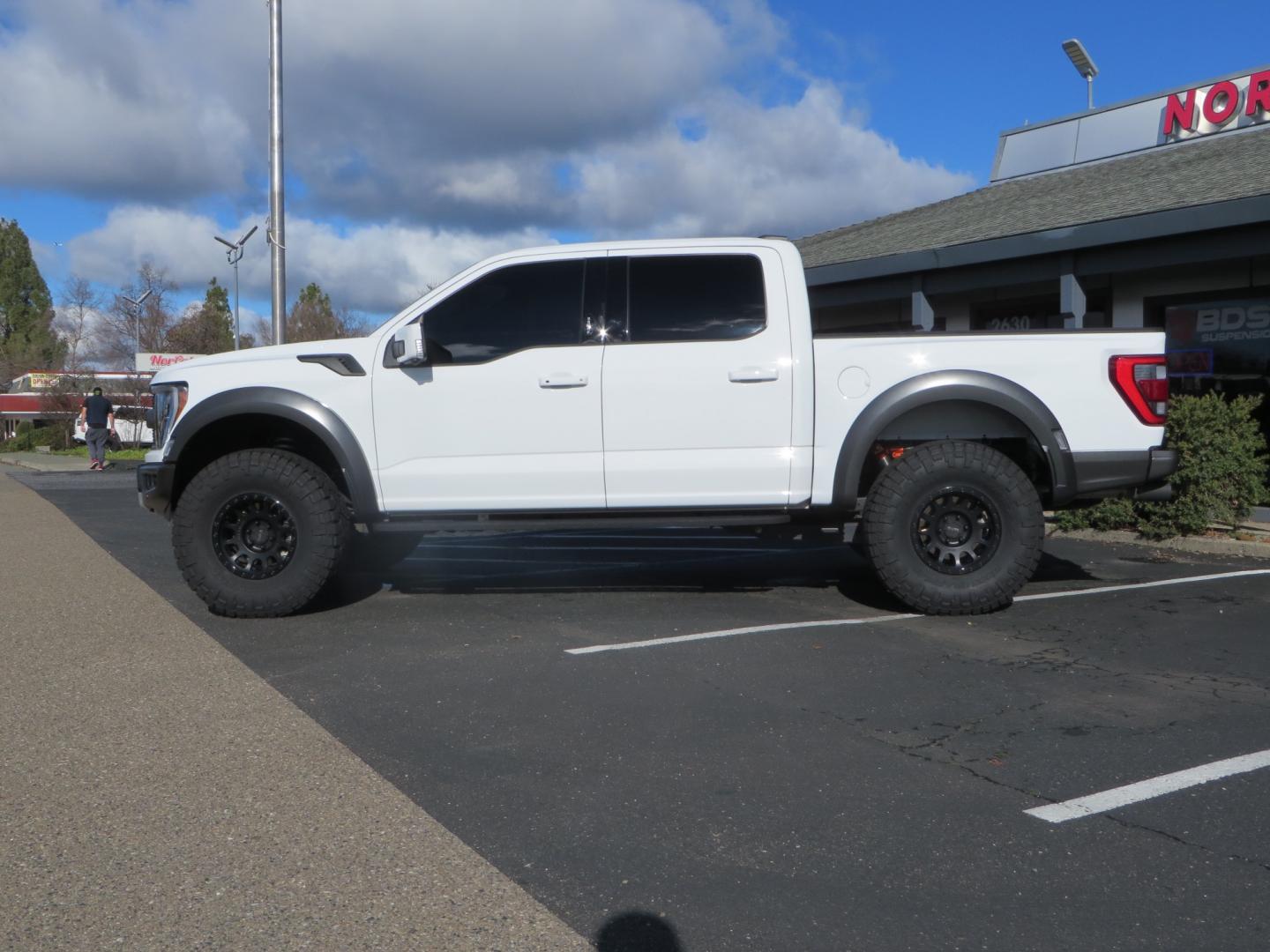 2023 White /BLACK Ford F-150 Raptor SuperCrew 4WD (1FTFW1RG6PF) with an 3.5 V6 engine, 6A transmission, located at 2630 Grass Valley Highway, Auburn, CA, 95603, (530) 508-5100, 38.937893, -121.095482 - Raptor sitting on Eibach front and rear springs, 37" Nitto Ridge Grappler tires, 17" Method NV wheels, and window tint. - Photo#6